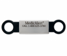 Black silicone and stainless Steel Shoe tag with a Medicalert logo in the middle
