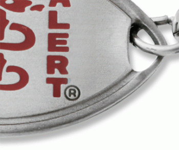 Close up of front of Classic MedicAlert bracelet showing red logo on front of emblem