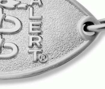 A close-up view of a stainless steel petite embossed medical ID bracelet with oval MedicAlert emblem