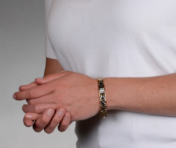 Sleek Medical ID Bracelet Gold with white logo on wrist
