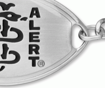 Close-up view of large medical ID bracelet with oval MedicAlert emblem and logo in black