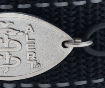 Close-up view of a black sport band medical ID bracelet with oval MedicAlert emblem and log